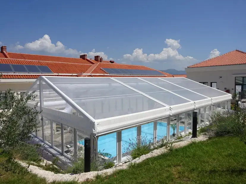 Custom poly-glass wall tent with openable sides for hotel swimming pool extension