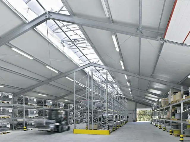 Inside the Superb Holaj warehouse tent showing durable aluminum frame and flexible layout for logistics storage