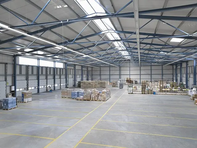 Interior view of a 20x45m industrial warehouse tent with spacious storage capacity and modular design