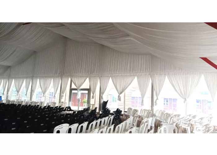 spacious interior of 30x50m transparent roof church marquee with seating layout for revival meetings