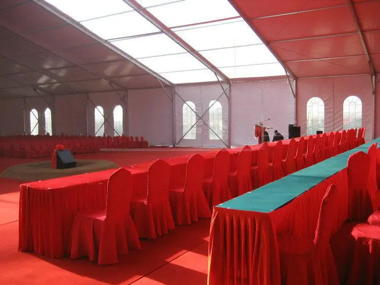 Business forum interior layout with stage and rows of chairs
