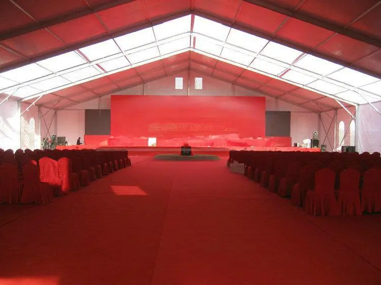 Conference tent interior with lighting and multimedia setup