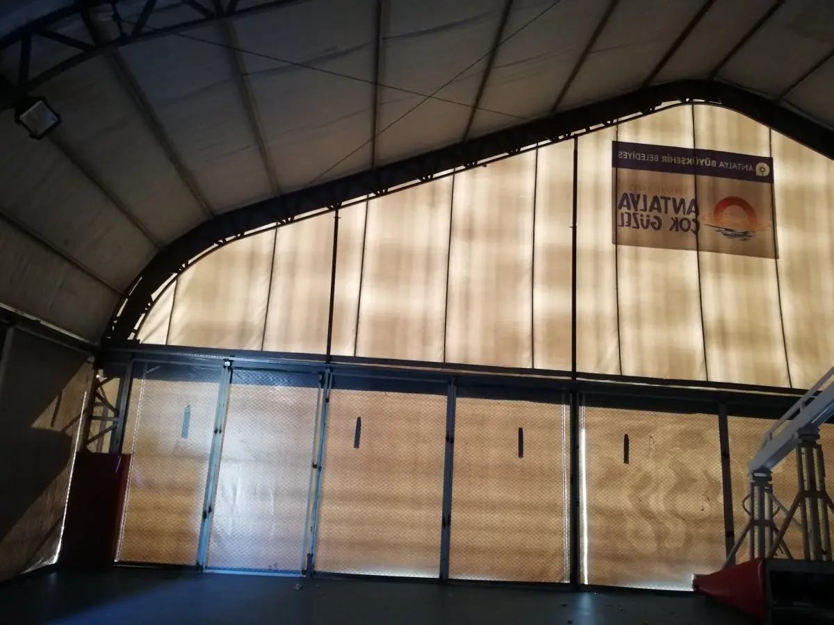 interior view of basketball tent with full-size court and lighting