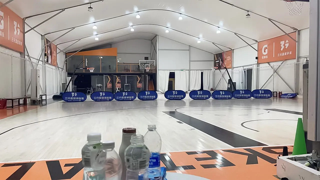 Audience seating and court area inside all-weather basketball tent in Shenzhen