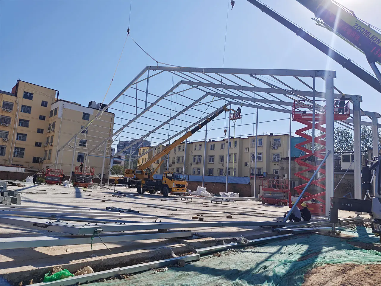 Construction of 60x120m American Basketball Tent with aluminum frame assembly in progress