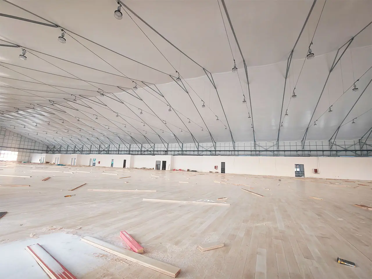 Inside view of 60x120m American Basketball Tent showing interior customization in progress
