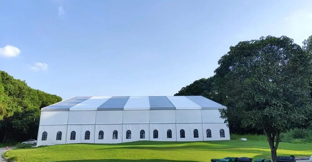 Interior of 45x45m Norway Tennis Tent with tennis court setup in progress