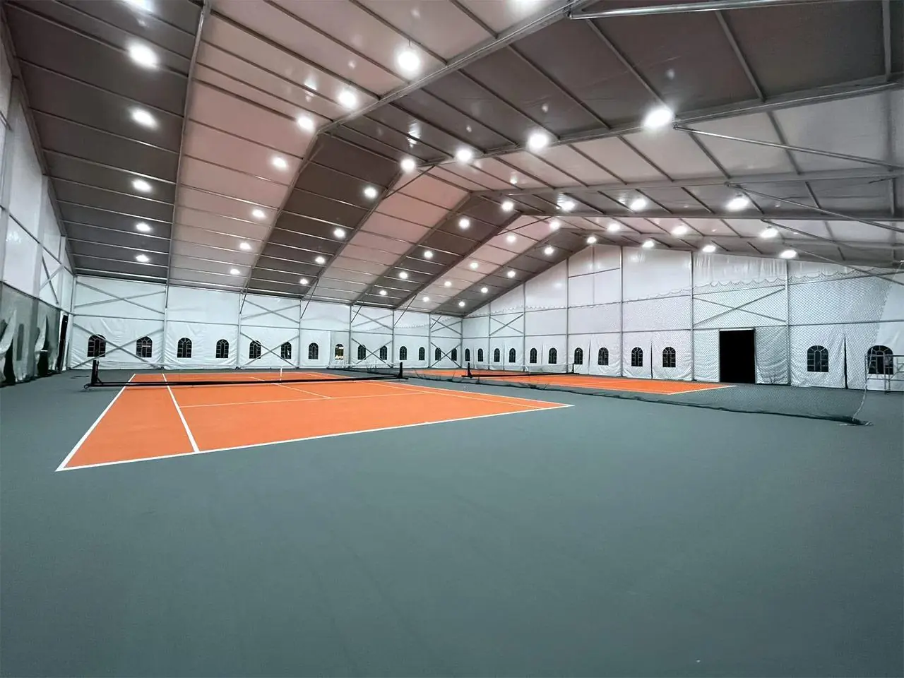 Outdoor perspective of 45x45m Norway Tennis Tent showcasing aluminum frame structure