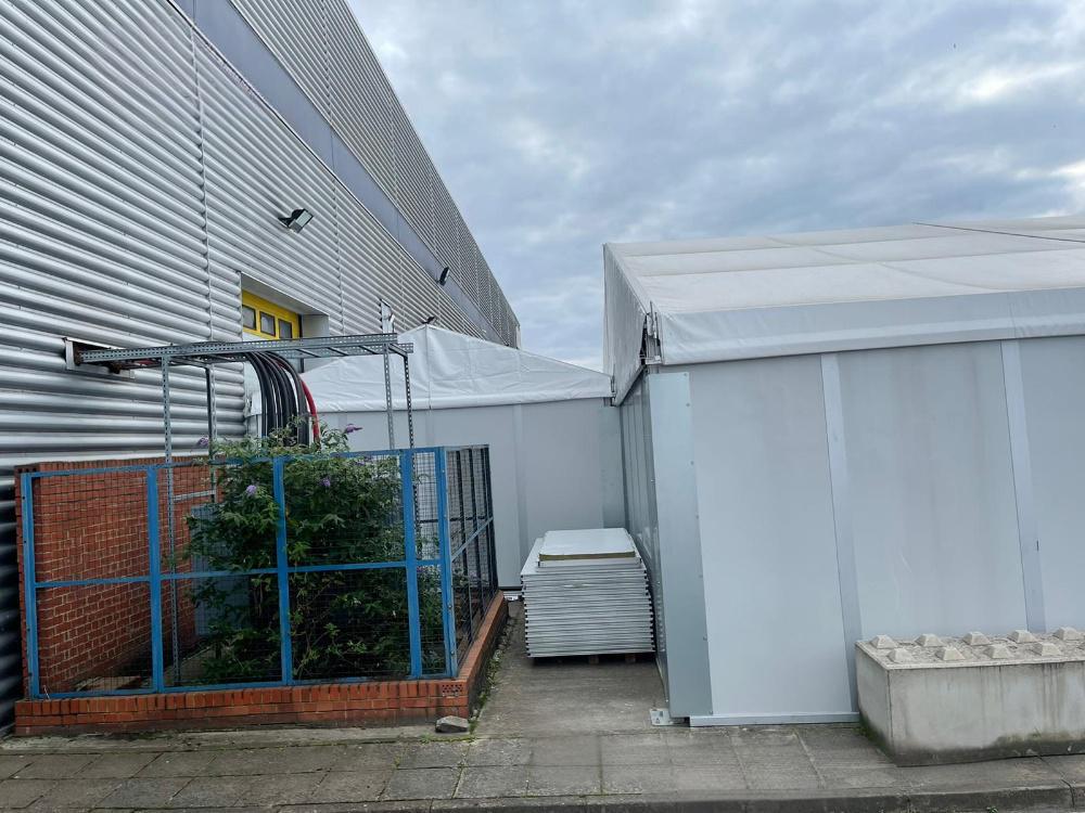 15x15m UK Workshop Tent exterior in a professional UK warehouse setting