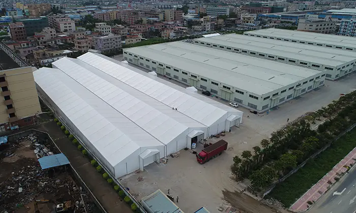 Aerial view of AluFrameTech's 20x115m USA Large Storage Tent showcasing its expansive structure and surroundings.