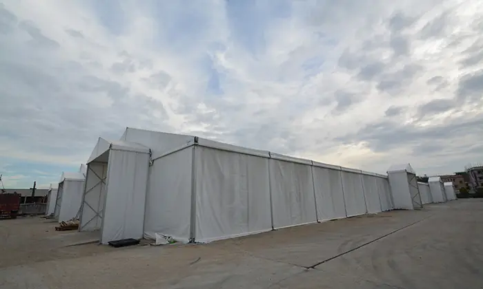 Side perspective of AluFrameTech's 20x115m storage tent highlighting its robust aluminum frame and weather-resistant PVC fabric.