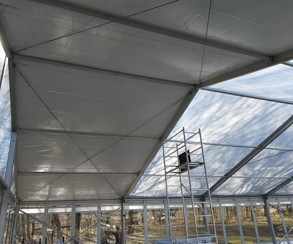 Installing glass walls for 15x20m wedding tent in Budapest, Hungary for durable event setup