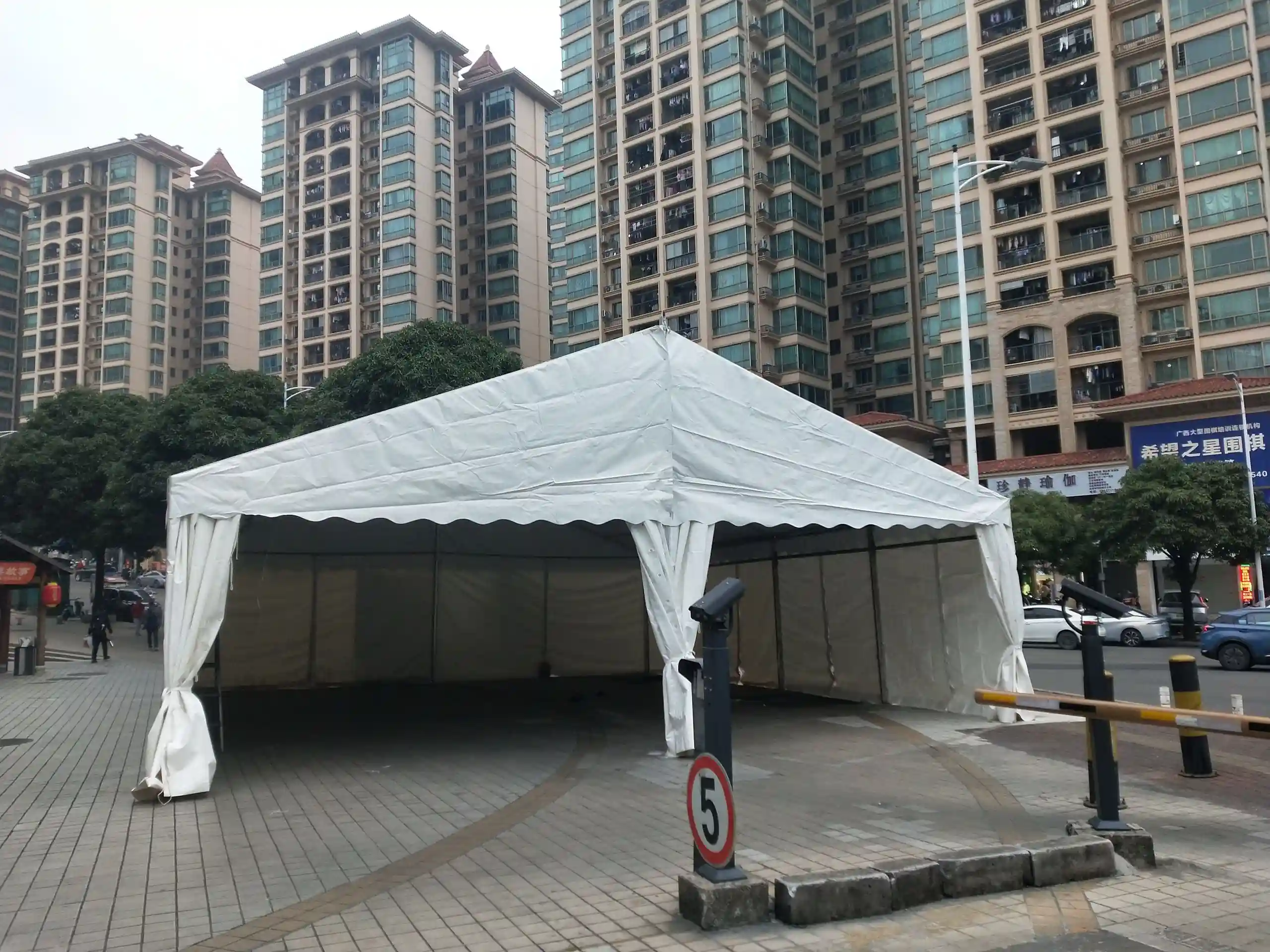 Elegant 10x20m Italian wedding tent exterior with 850g/m² PVC roof at sunset.