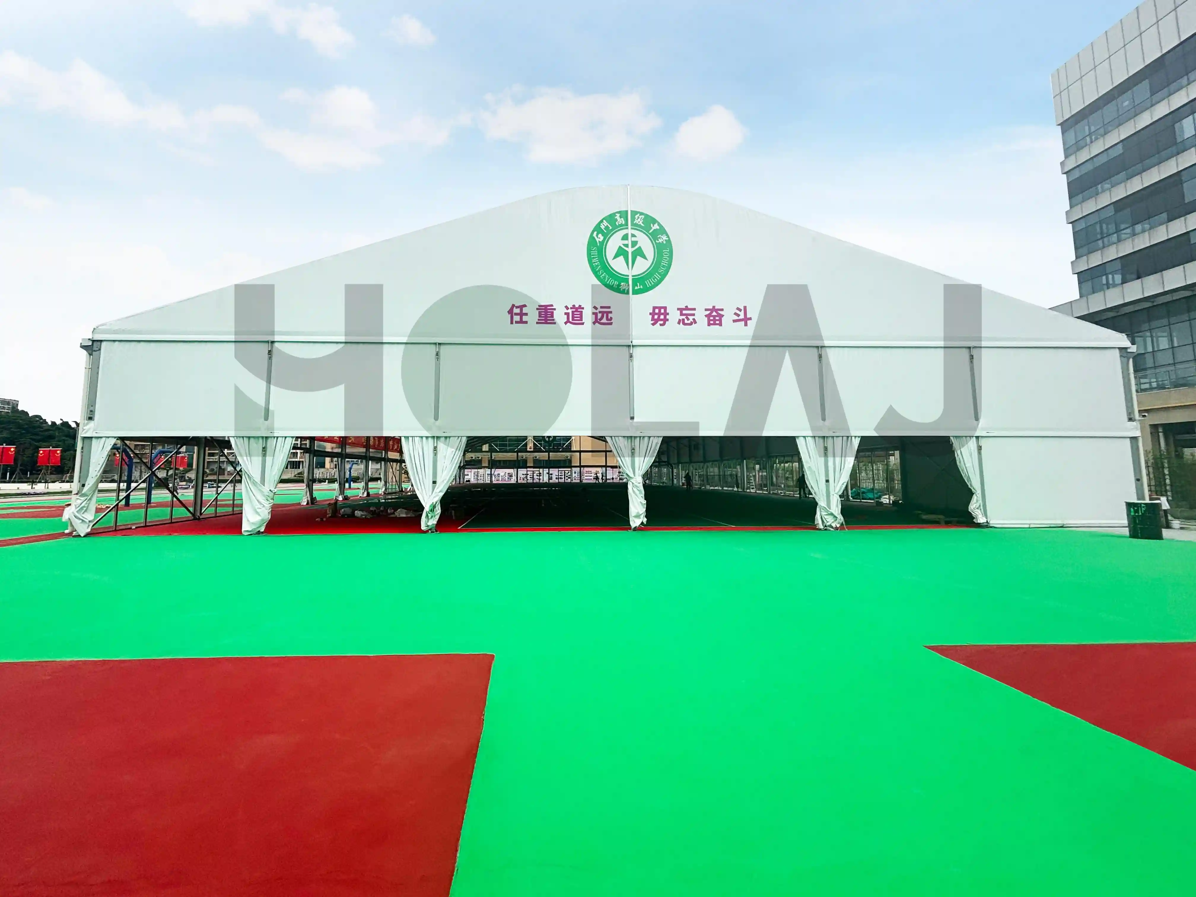 Exterior view of aluminum modular sports tent with PVC roof and glass walls